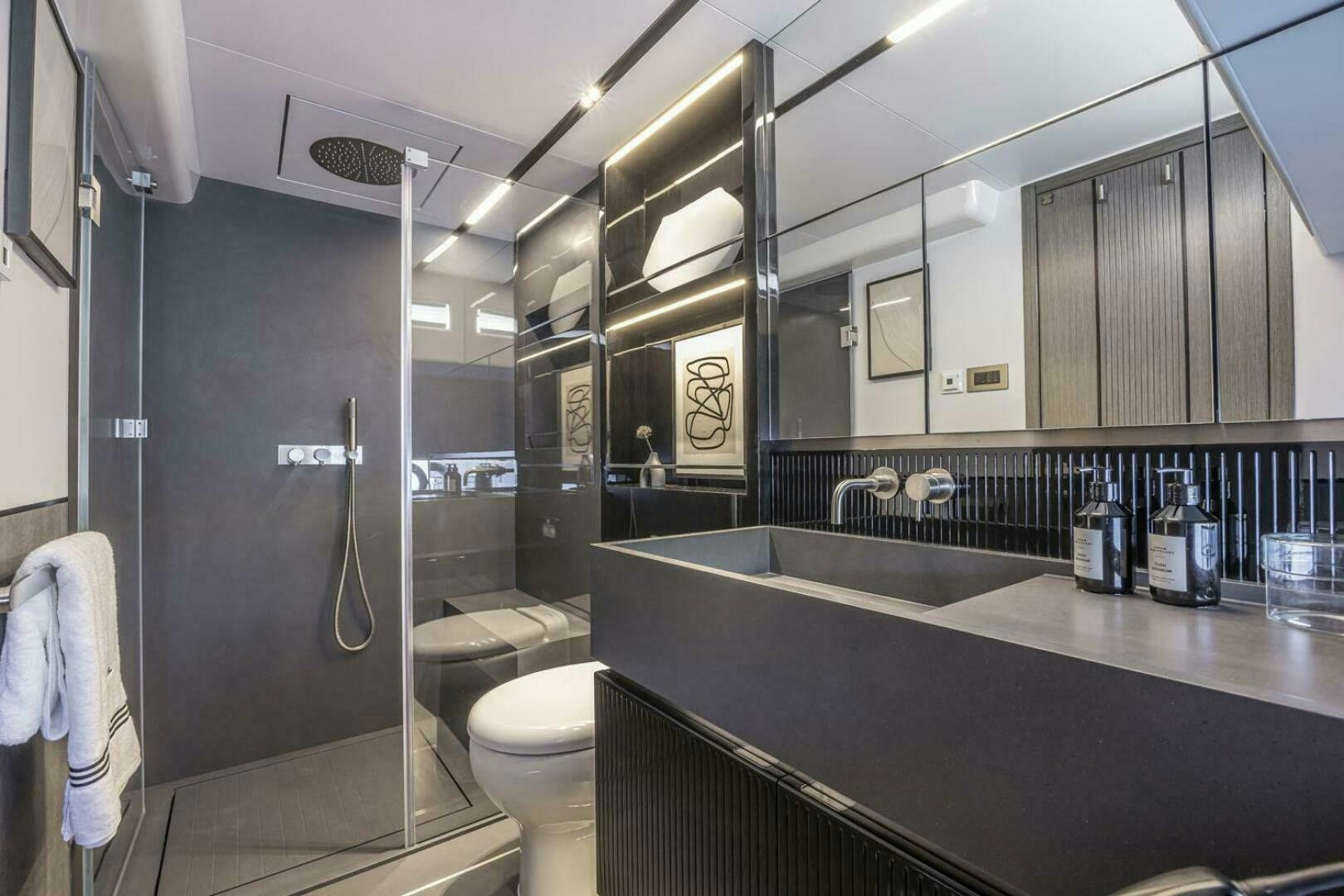 a bathroom with a glass shower aboard NONE Yacht for Sale