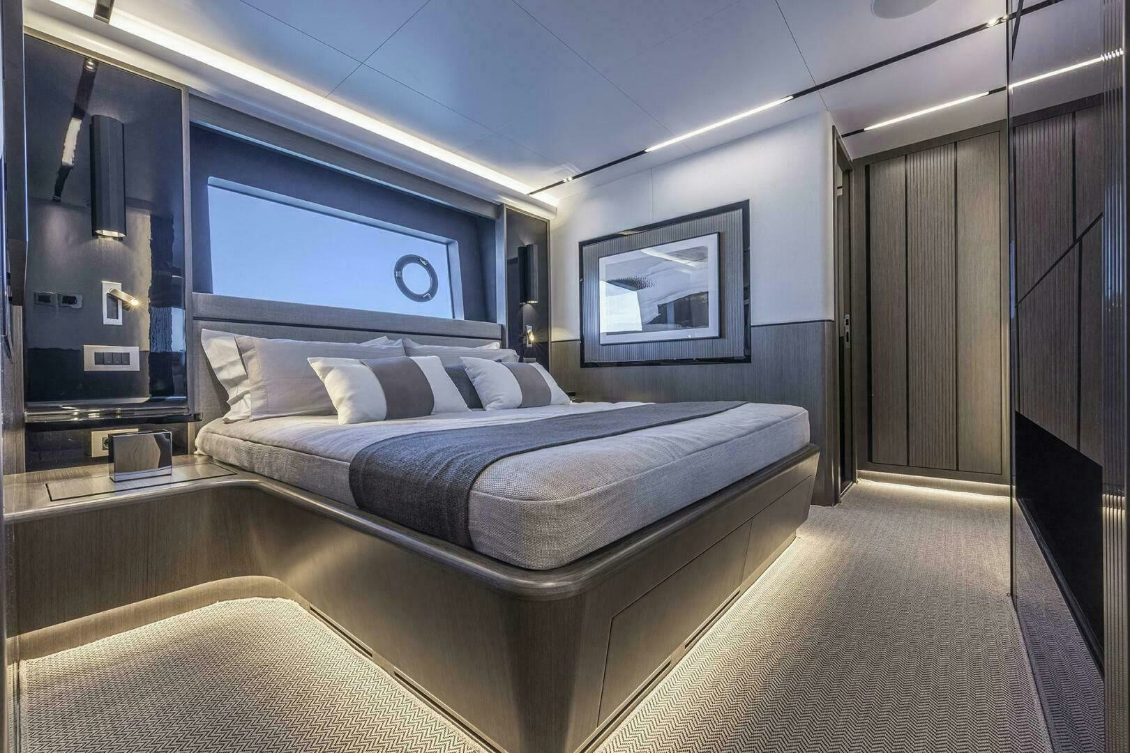 a room with a bed and a mirror aboard NONE Yacht for Sale
