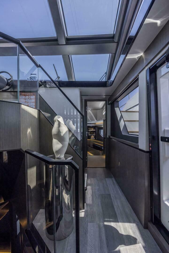 a white bird on a railing on a train platform aboard NONE Yacht for Sale