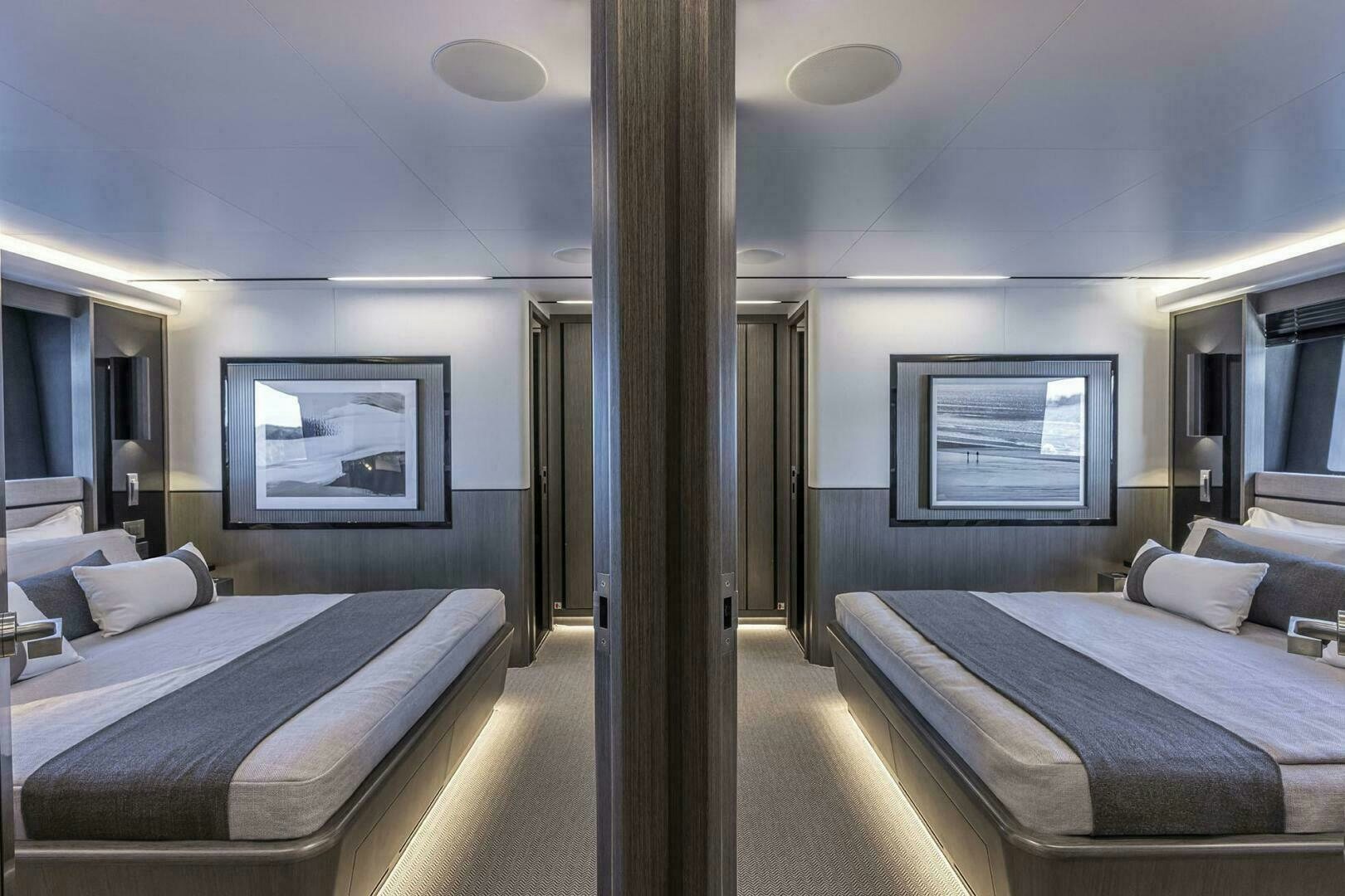 a room with beds and a tv aboard NONE Yacht for Sale