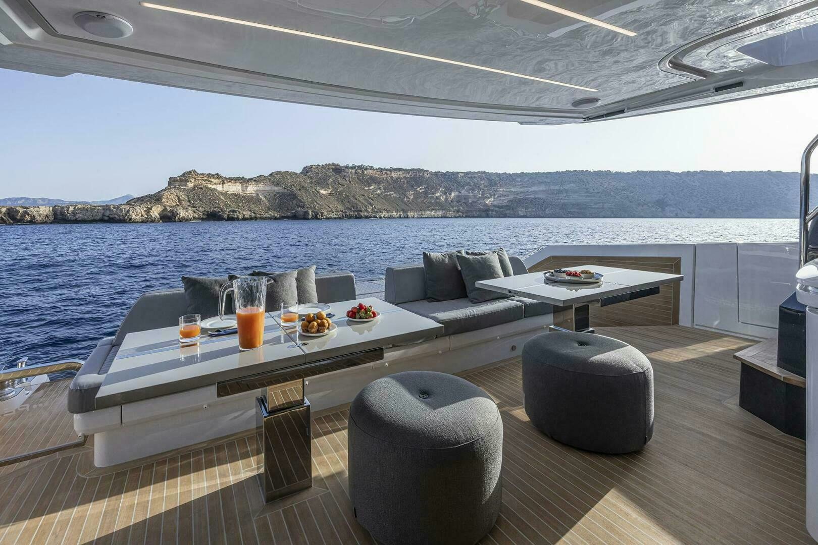 a table and chairs on a boat aboard NONE Yacht for Sale