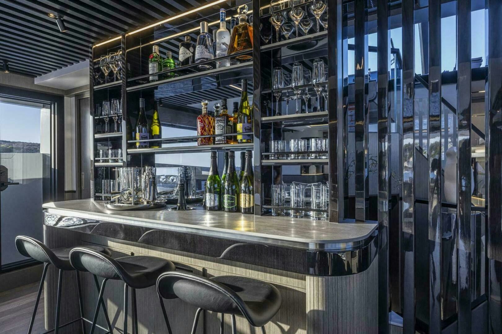 a bar with shelves of bottles aboard NONE Yacht for Sale