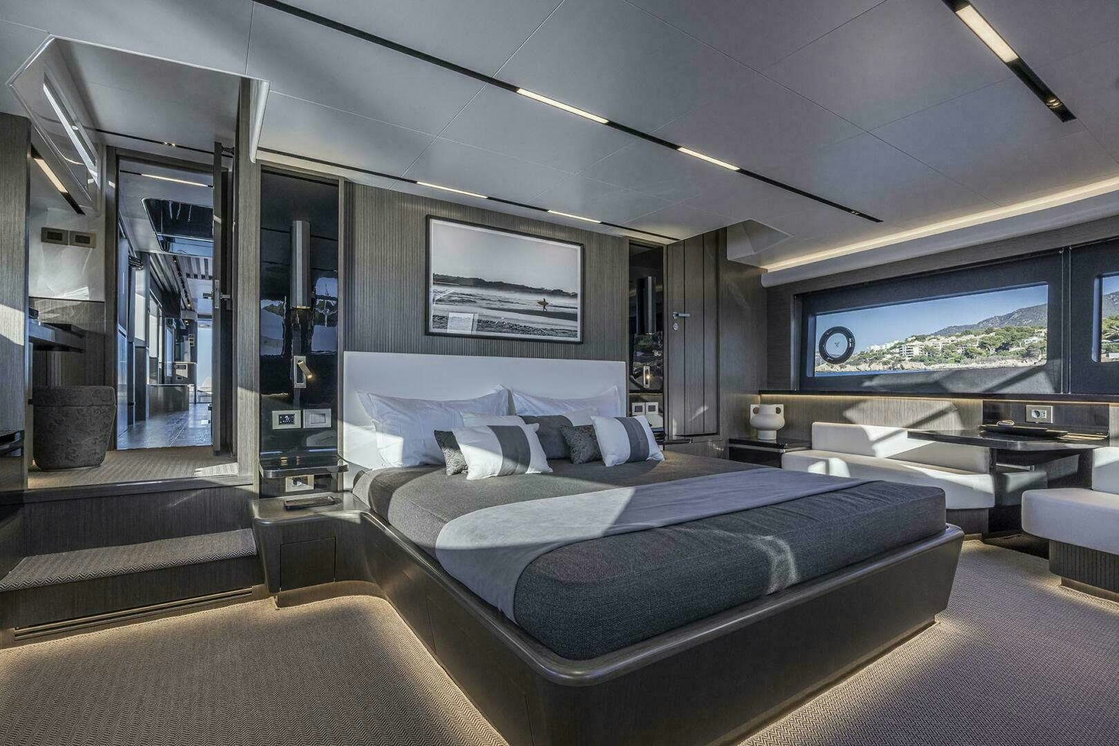a large modern room with a large bed and a large window aboard NONE Yacht for Sale