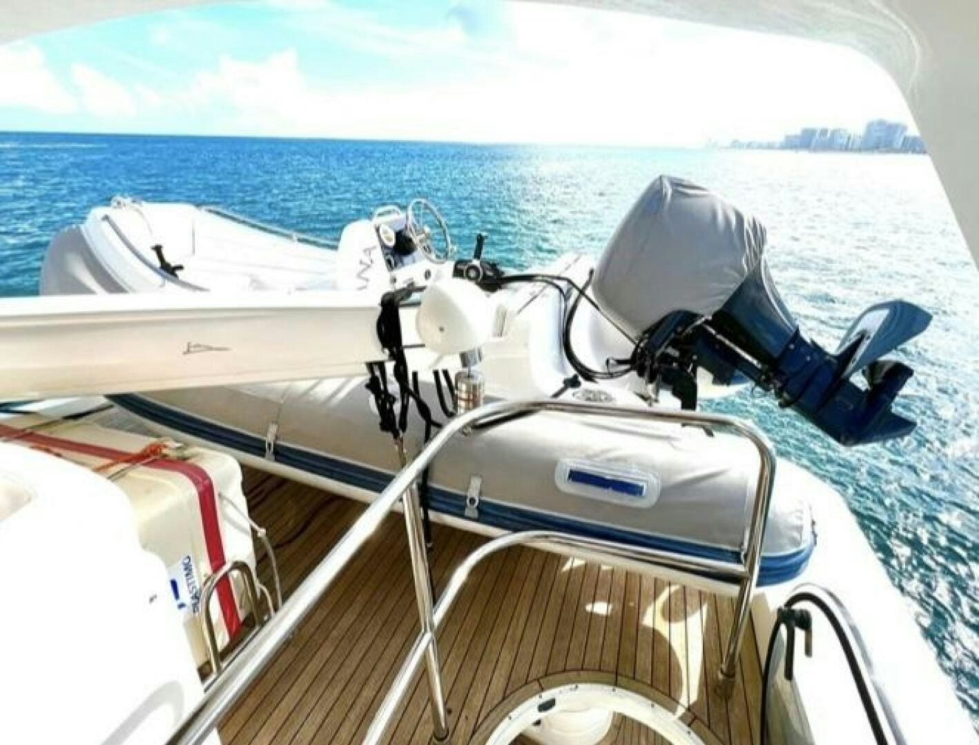 a boat with a steering wheel aboard UNIQ Yacht for Sale