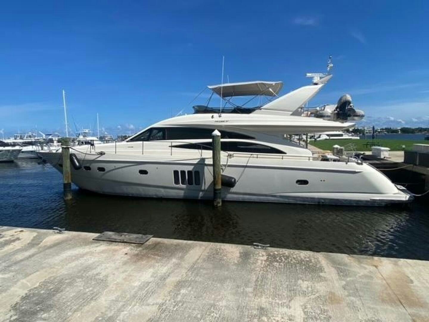 a yacht docked at a pier aboard UNIQ Yacht for Sale