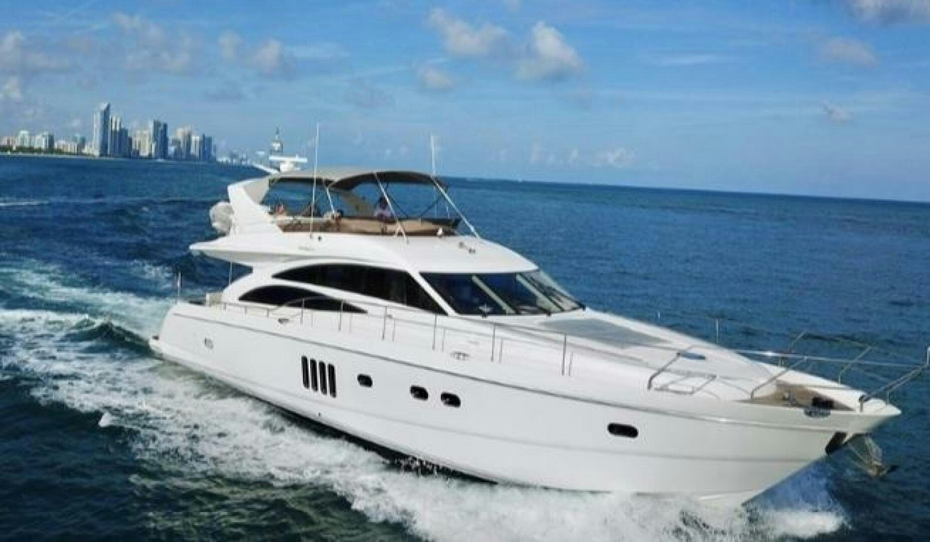 a white yacht on the water aboard UNIQ Yacht for Sale