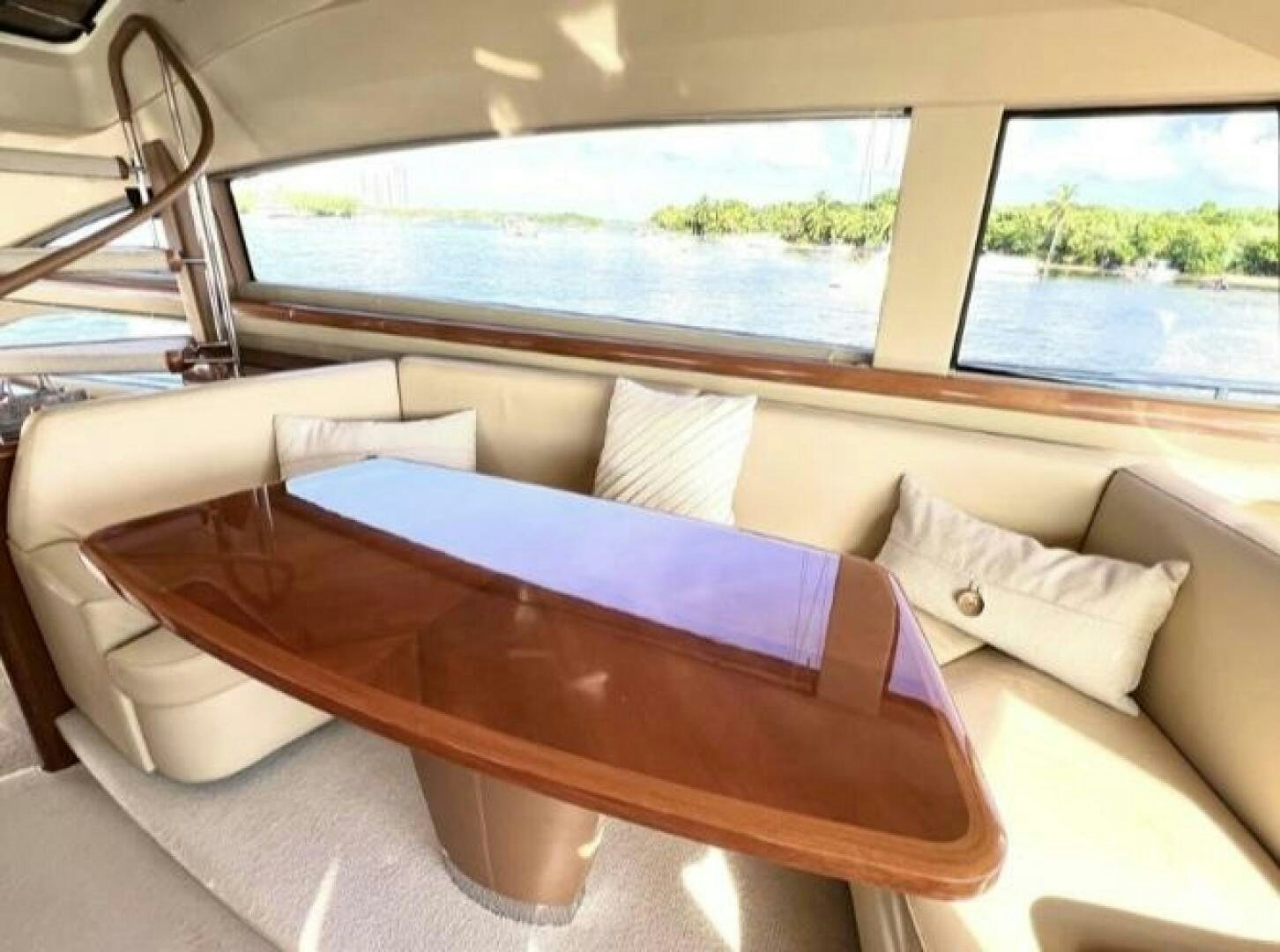a couch with a table on it aboard UNIQ Yacht for Sale