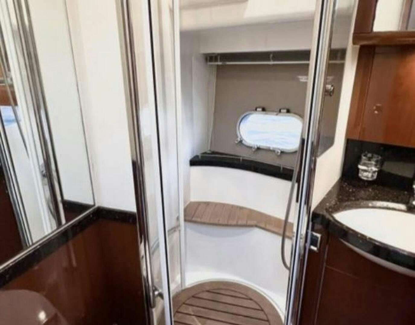 a bathroom with a tub and sink aboard UNIQ Yacht for Sale