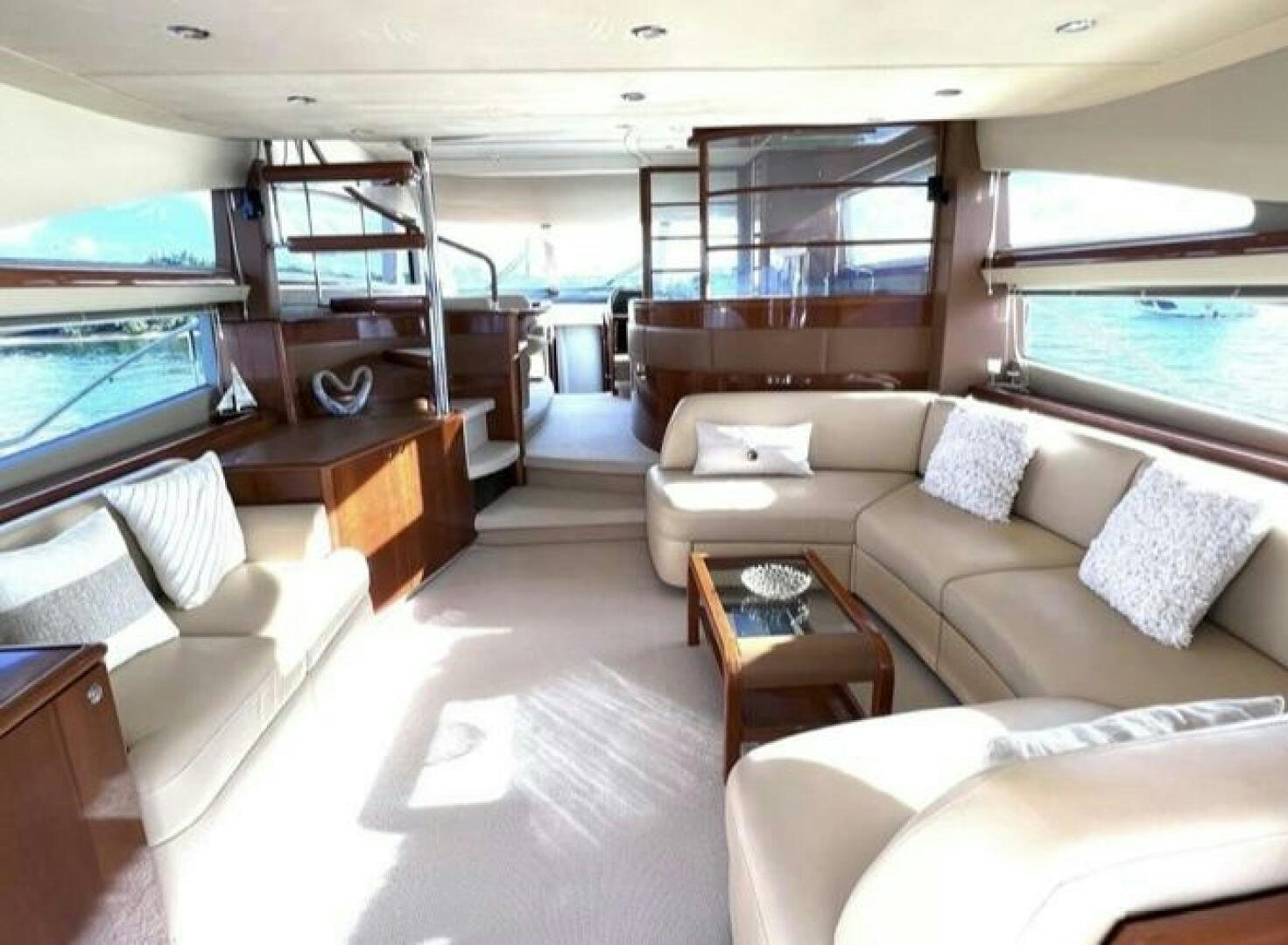 a living room with a large window aboard UNIQ Yacht for Sale
