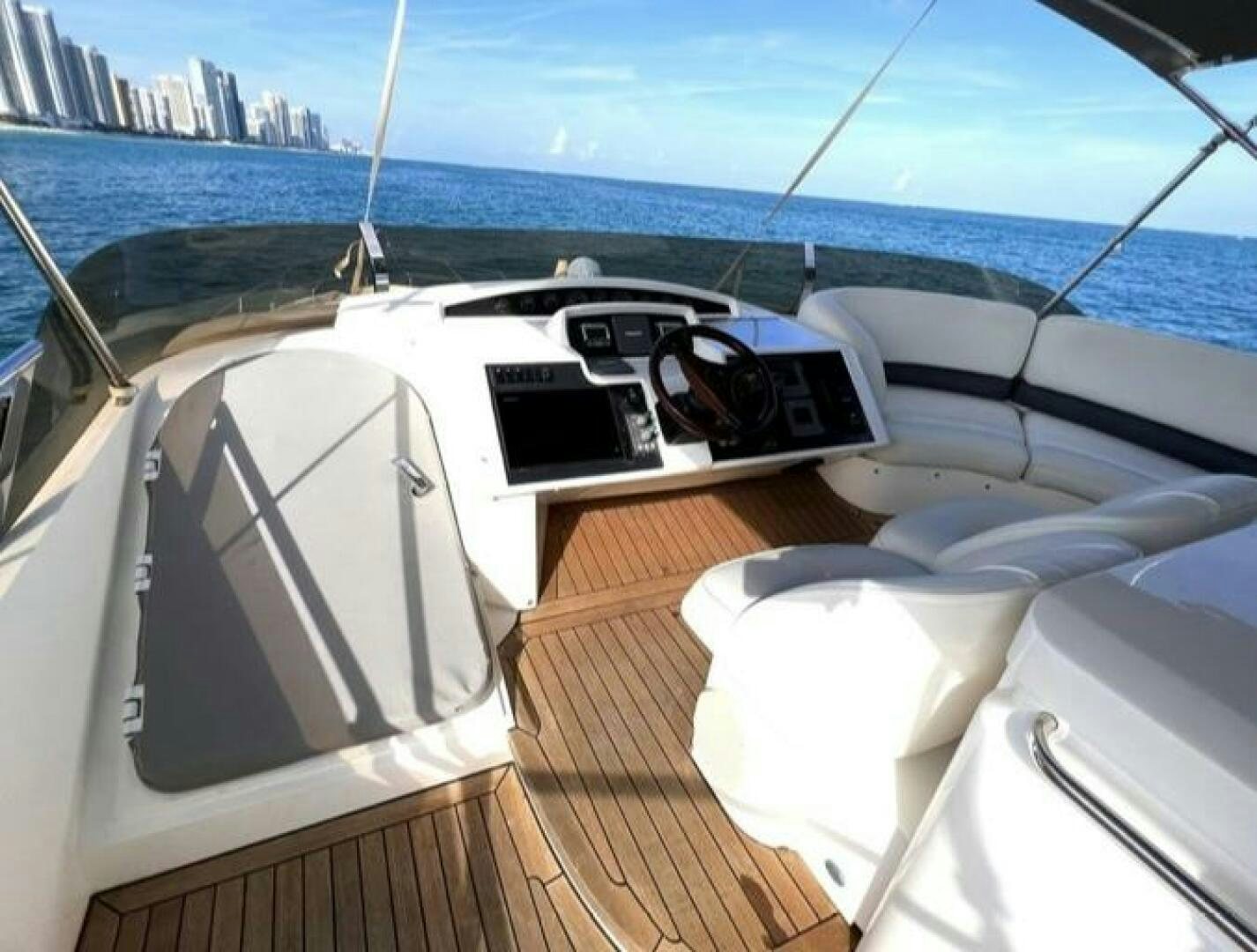 a boat with a deck and a deck and a large body of water aboard UNIQ Yacht for Sale