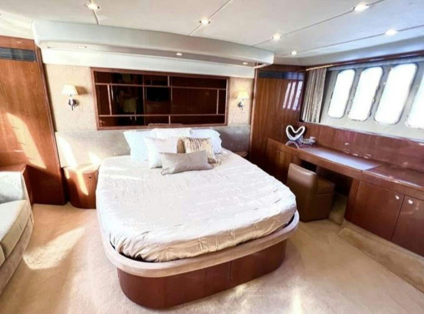 a bed in a room aboard UNIQ Yacht for Sale