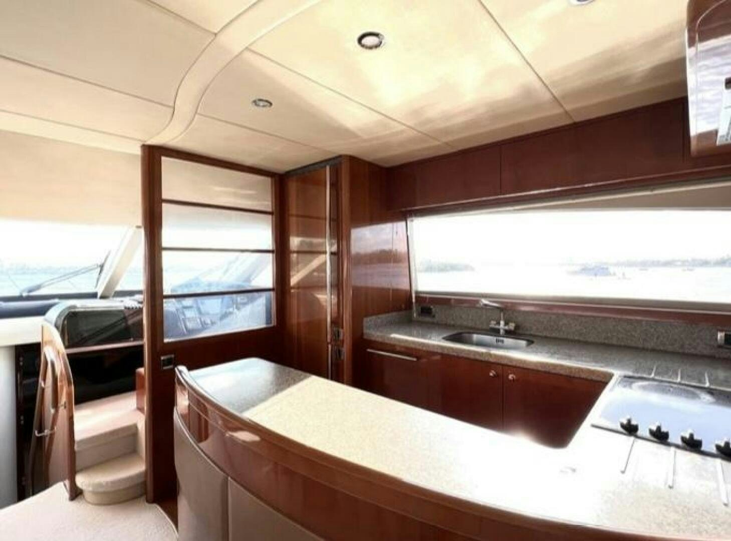 a kitchen with a large window aboard UNIQ Yacht for Sale