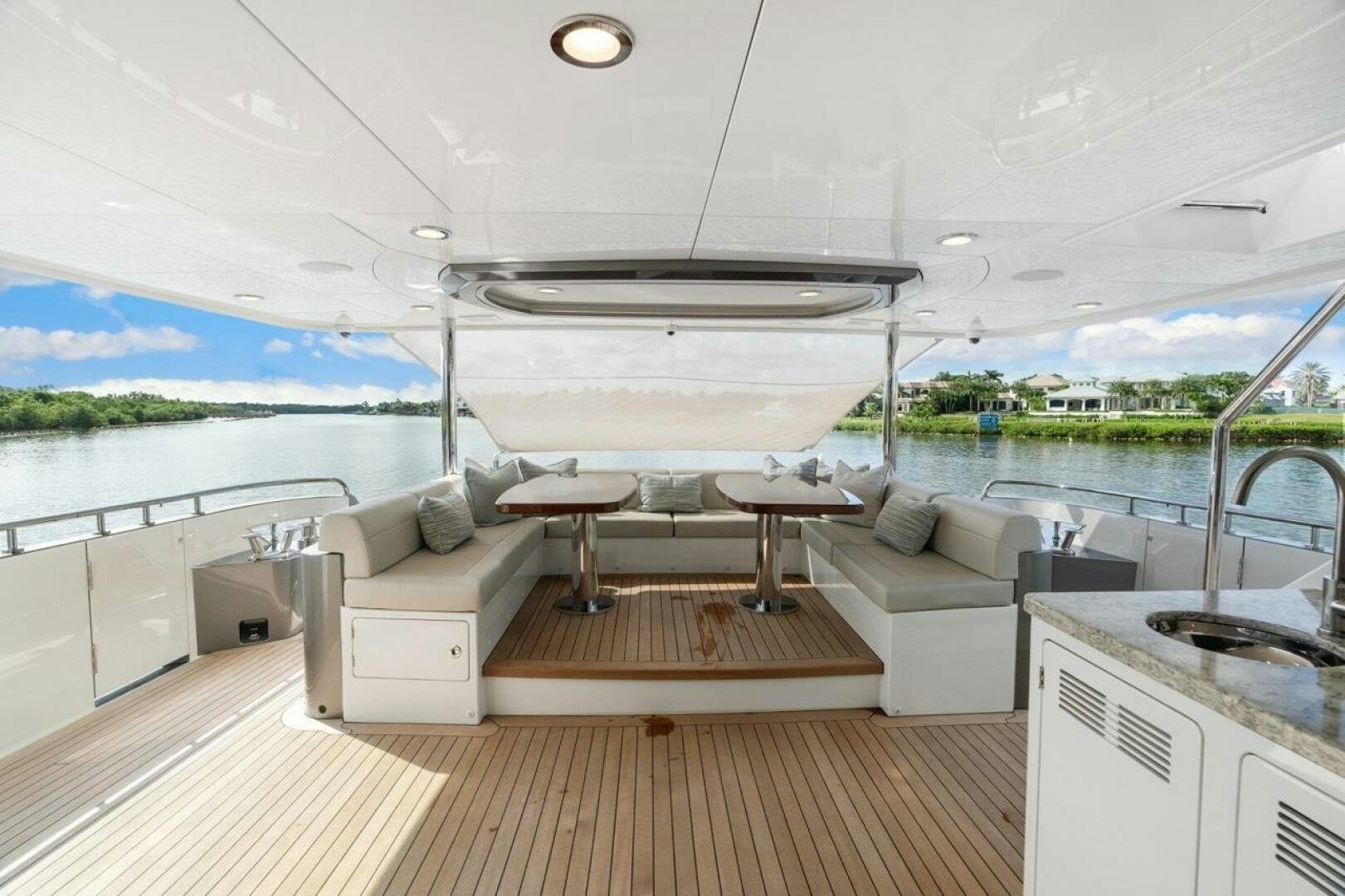 a room with a couch and a table and a pool aboard LADY G Yacht for Sale