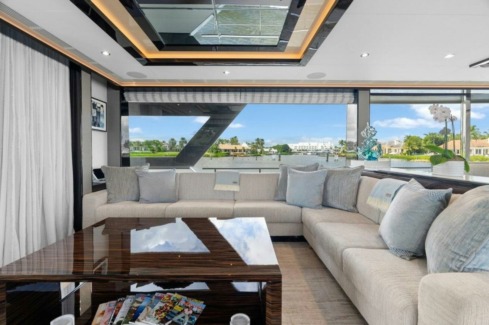 a living room with a large window aboard LADY G Yacht for Sale