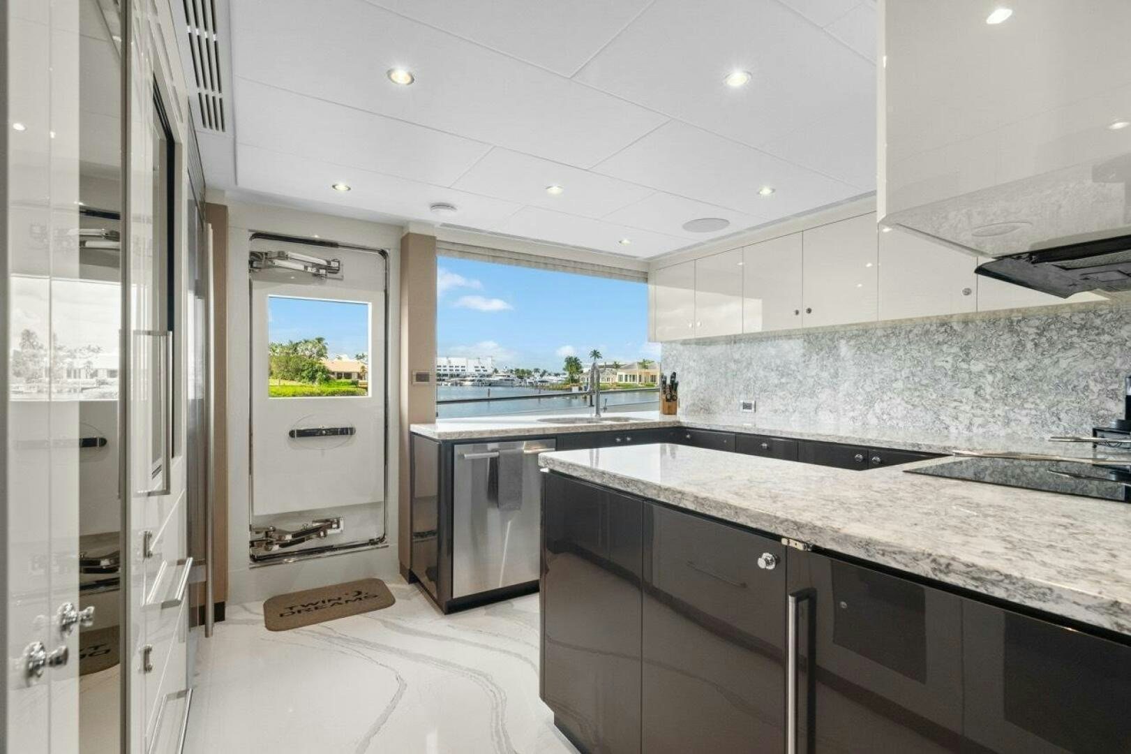 a kitchen with a large window aboard LADY G Yacht for Sale