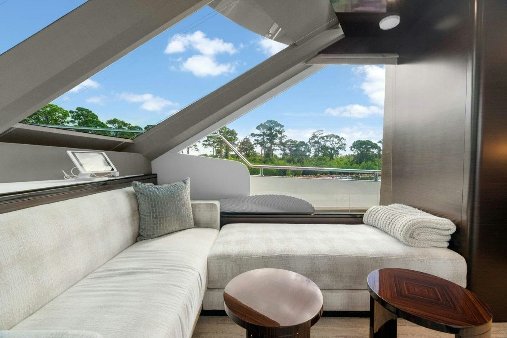 a room with a couch and a window aboard LADY G Yacht for Sale