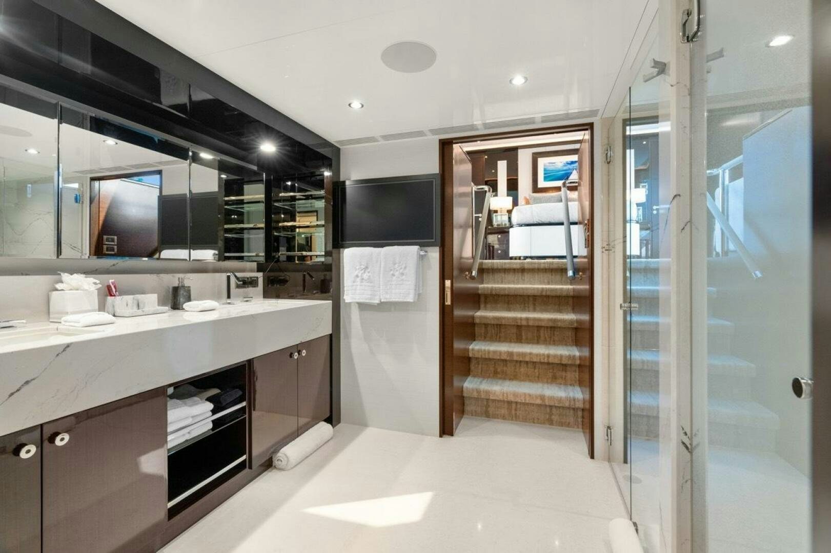 a bathroom with a large mirror aboard LADY G Yacht for Sale