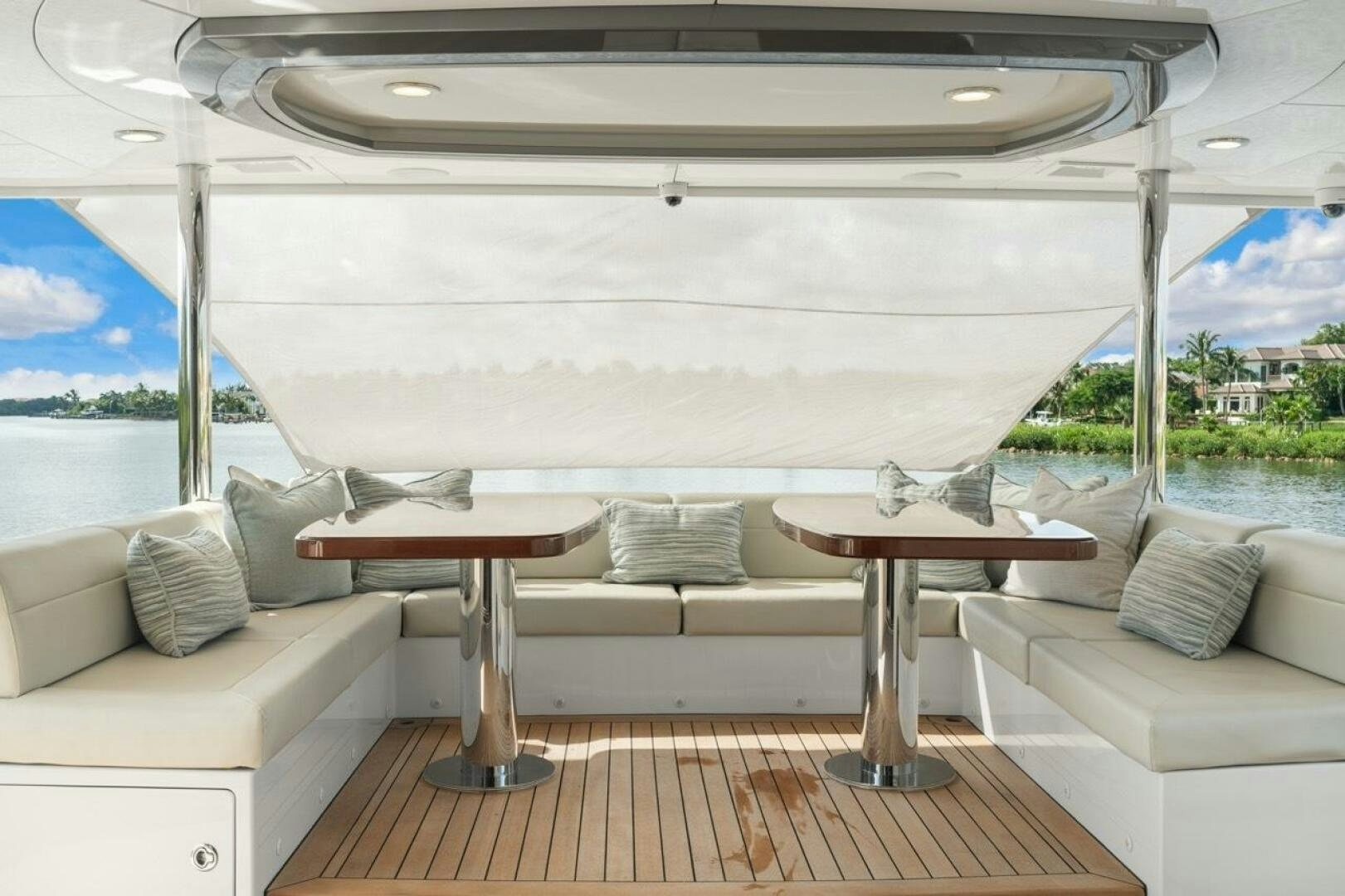 a room with a table and a couch aboard LADY G Yacht for Sale