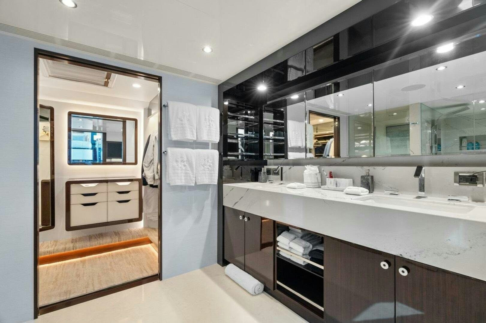 a bathroom with a sink and a mirror aboard LADY G Yacht for Sale