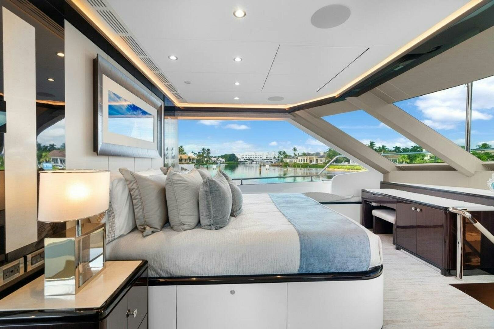 a room with a bed and a large window aboard LADY G Yacht for Sale