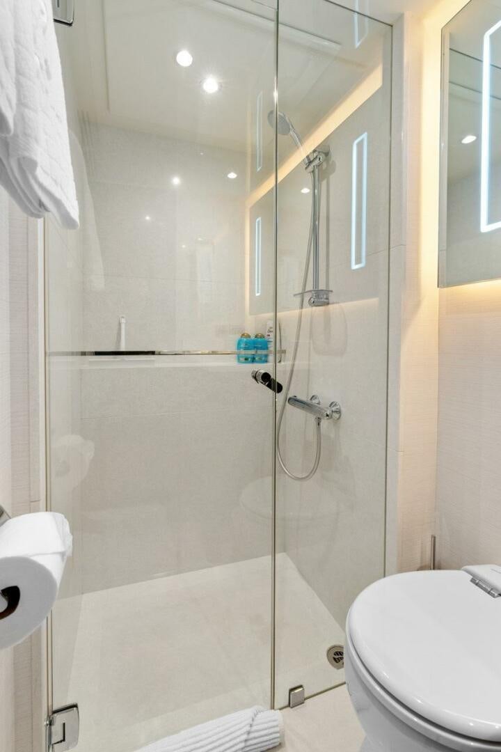 a bathroom with a shower unit aboard LADY G Yacht for Sale