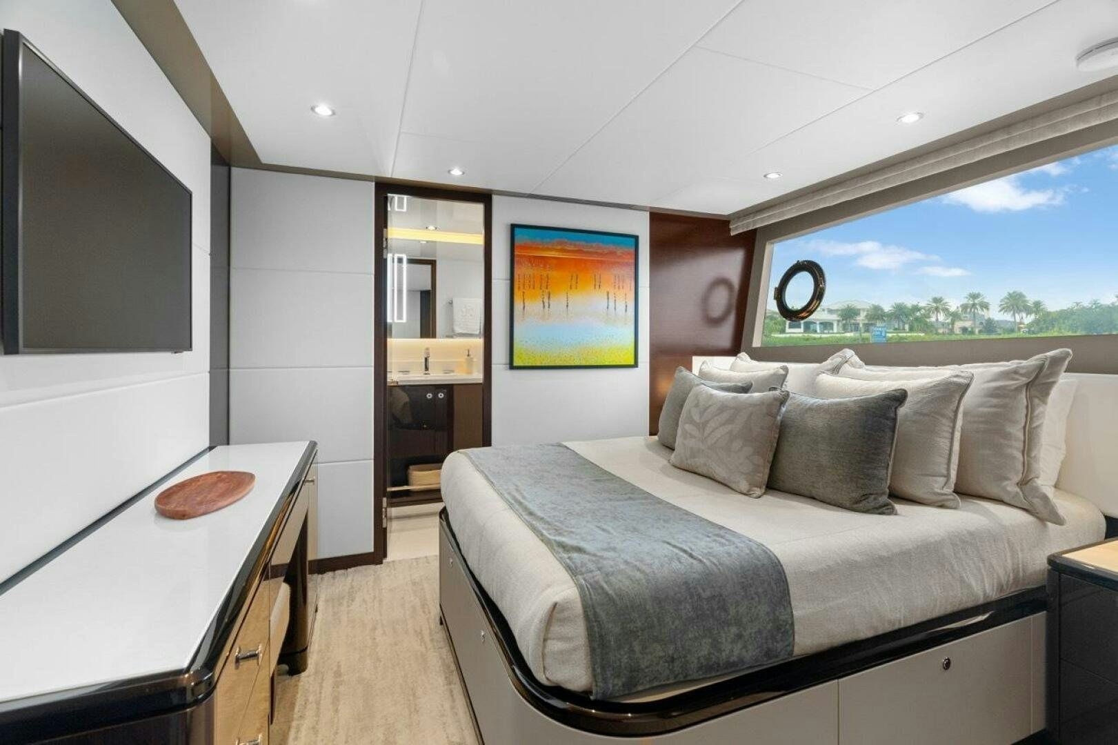 a bedroom with a large bed aboard LADY G Yacht for Sale