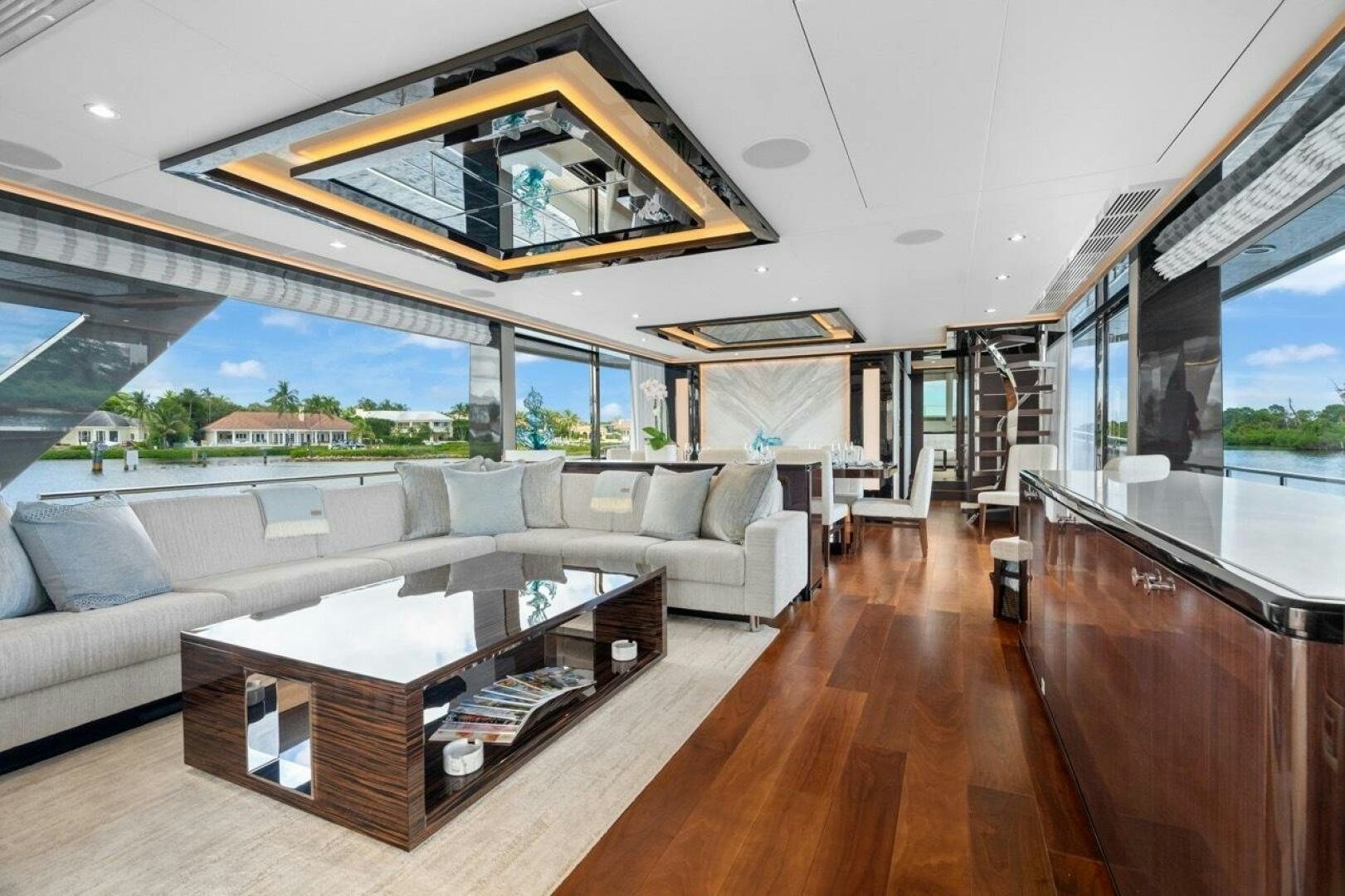 a living room with a large window aboard LADY G Yacht for Sale