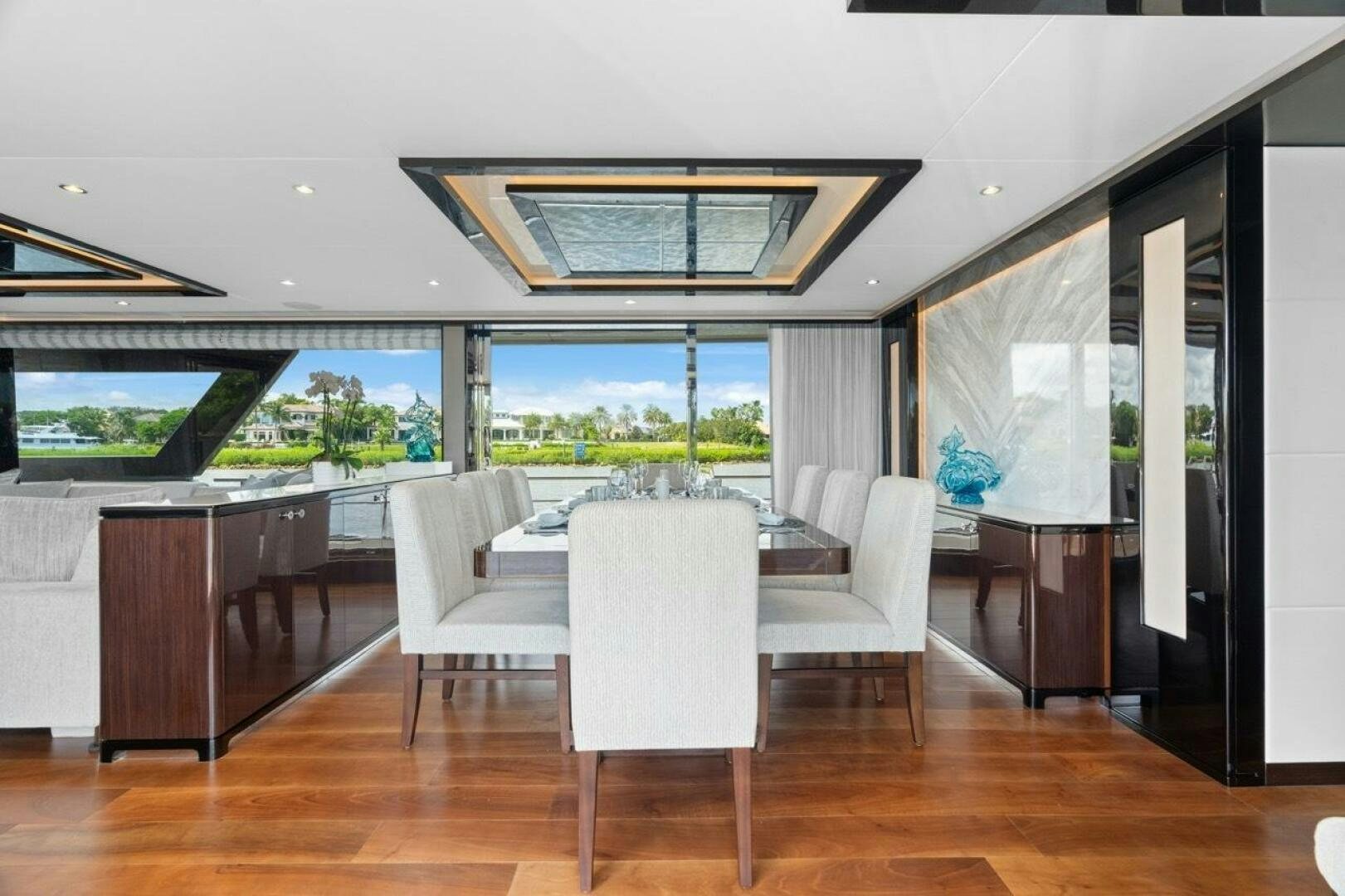a room with a table and chairs aboard LADY G Yacht for Sale