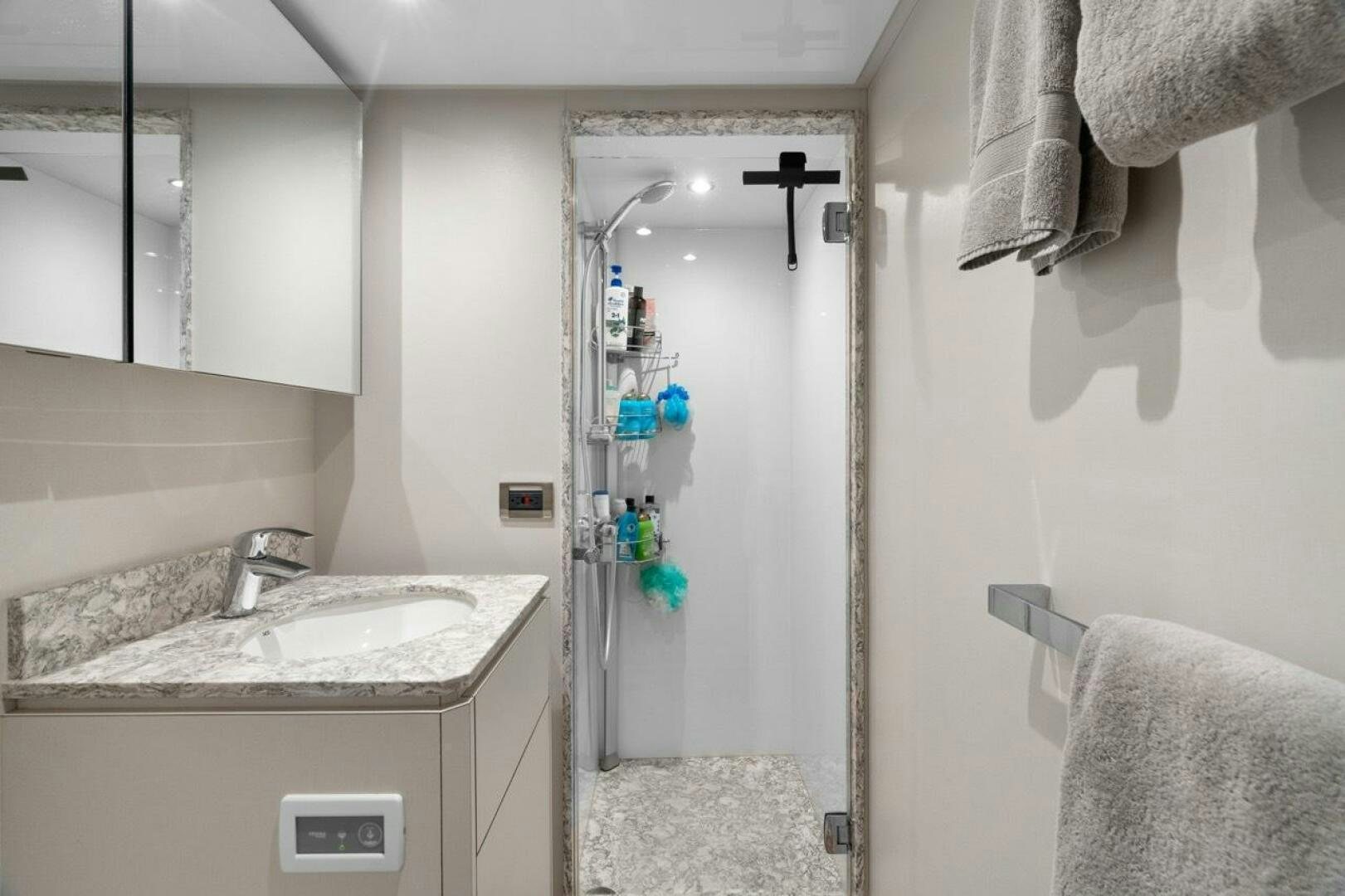 a shower unit and sink in a bathroom aboard LADY G Yacht for Sale