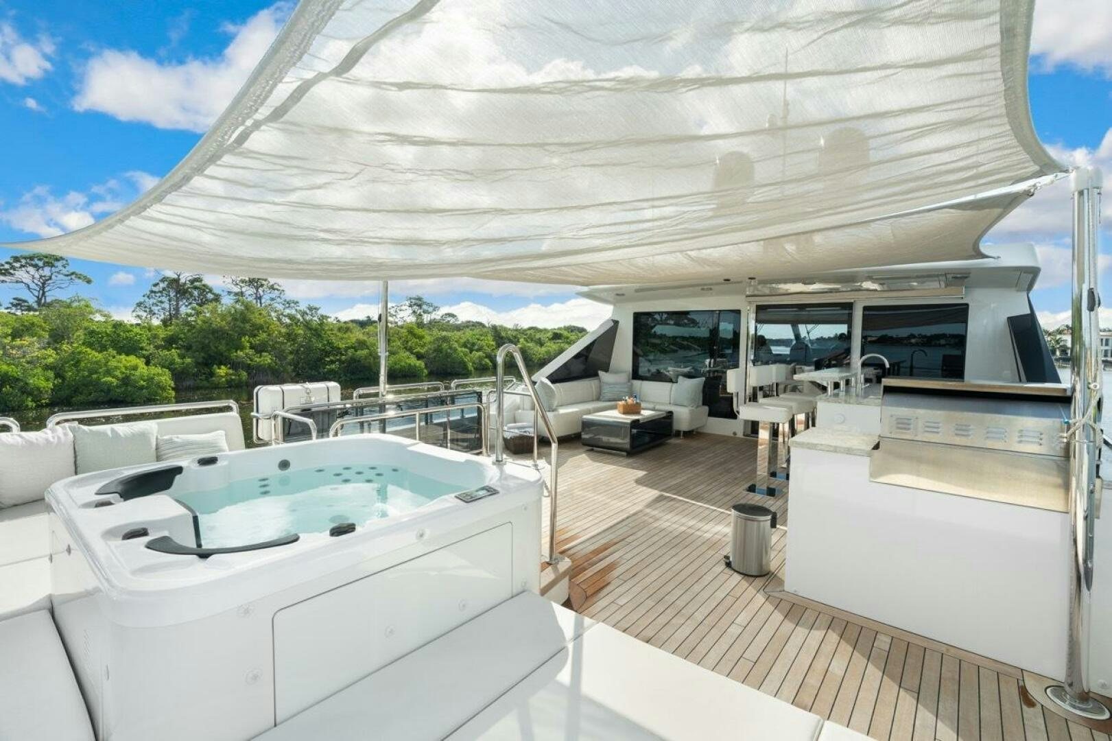a large white tent with a deck and a pool aboard LADY G Yacht for Sale