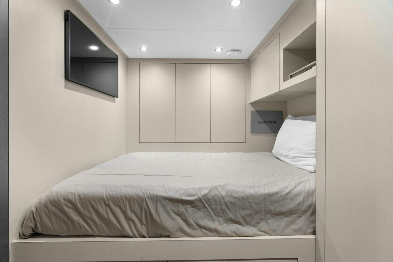 a white bed with a white pillow aboard LADY G Yacht for Sale