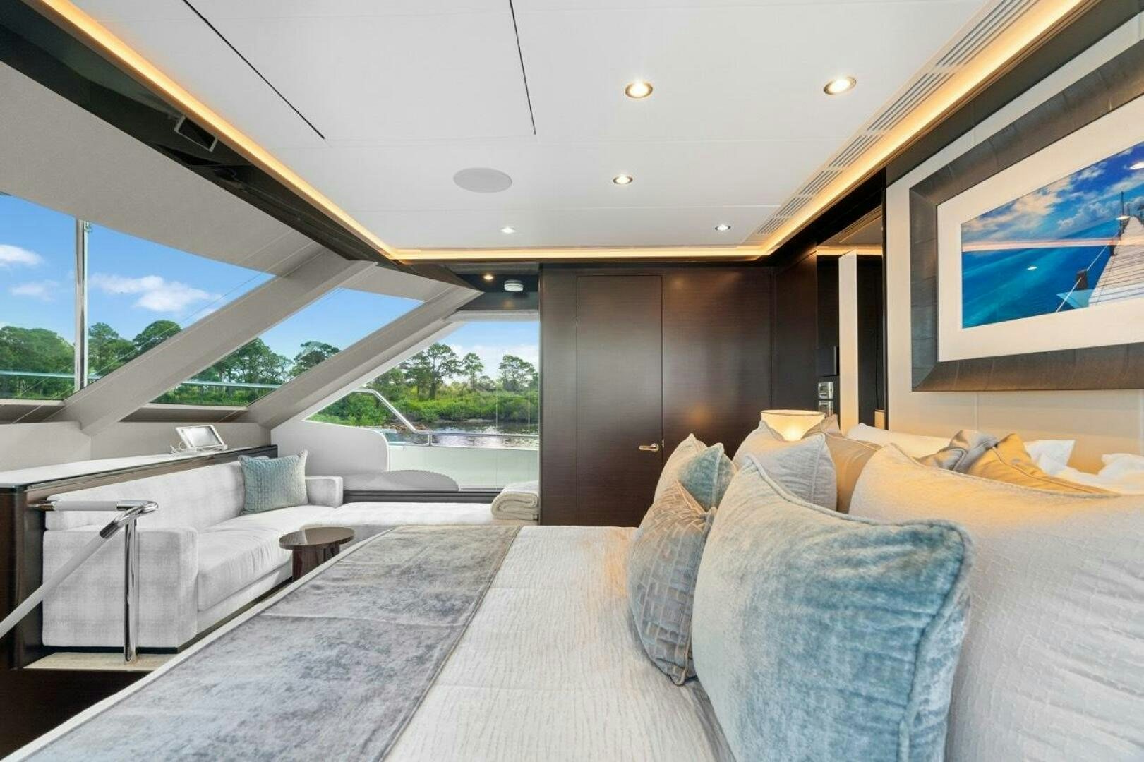 a modern bedroom with a large glass ceiling aboard LADY G Yacht for Sale