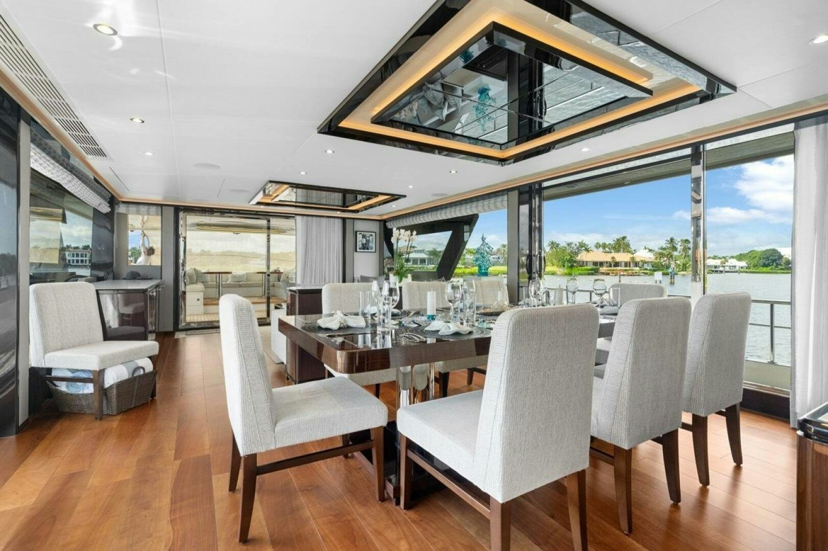 a dining room with a large glass window aboard LADY G Yacht for Sale