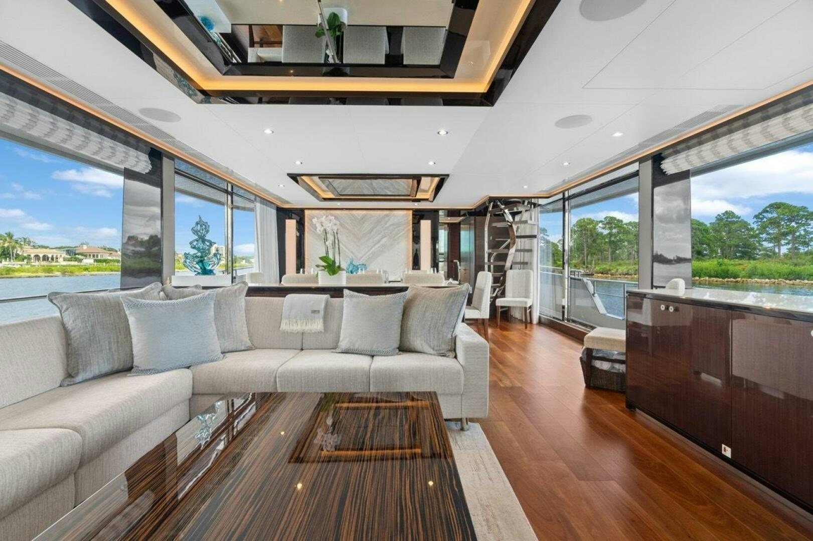 a living room with a wood floor aboard LADY G Yacht for Sale