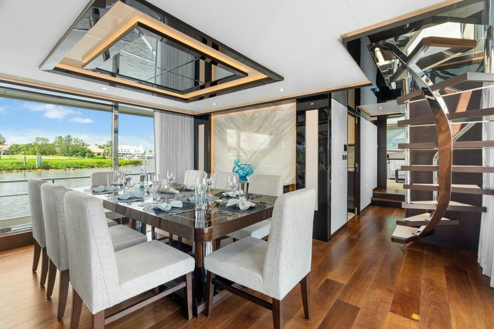 a dining table and chairs aboard LADY G Yacht for Sale