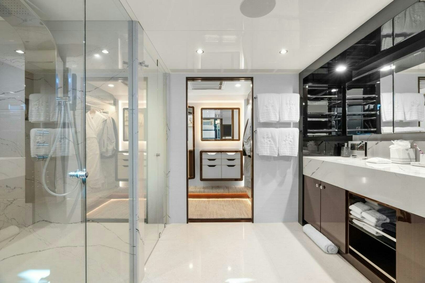 a bathroom with a glass shower aboard LADY G Yacht for Sale