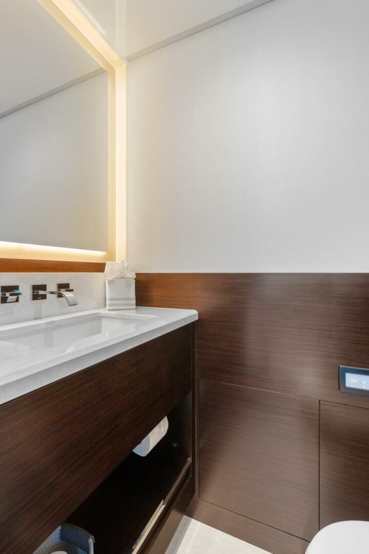 a bathroom with a sink and a mirror aboard LADY G Yacht for Sale