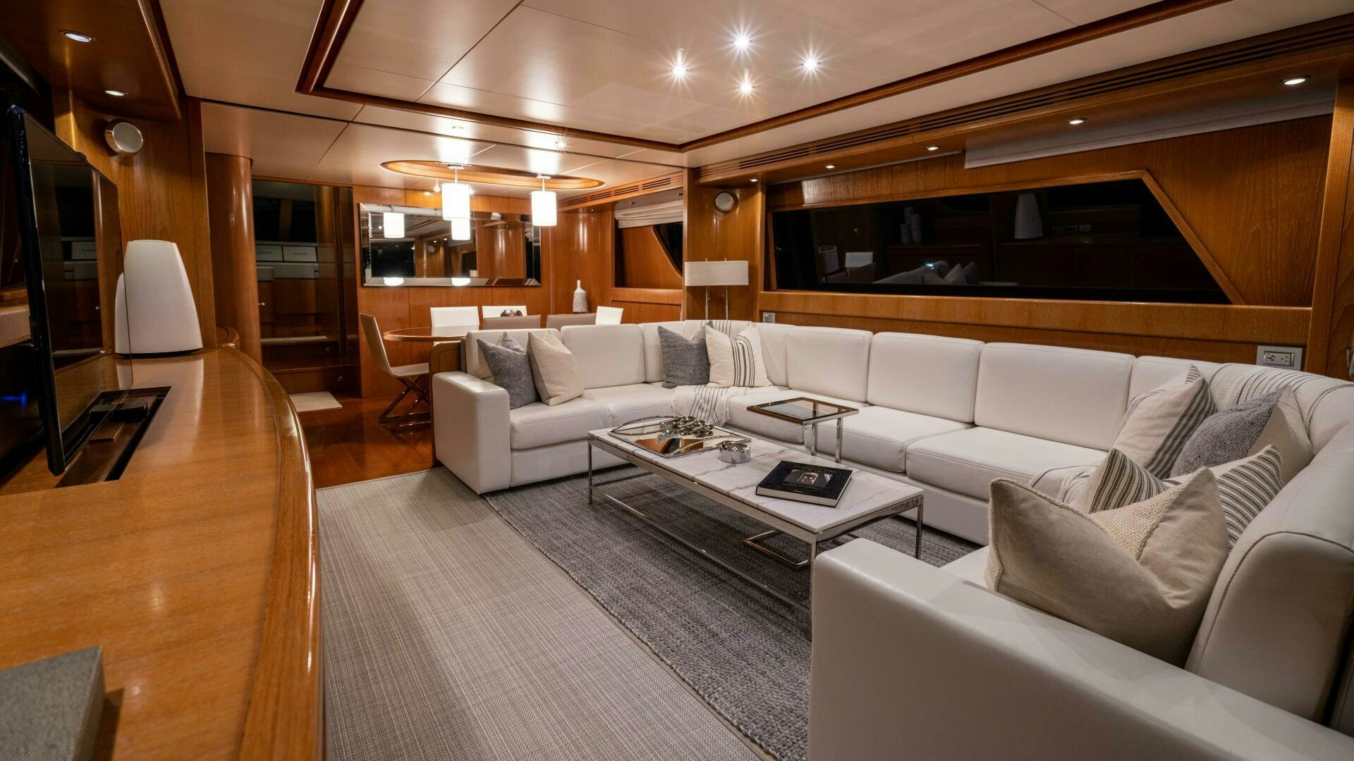 a living room with a couch and a coffee table aboard LOSAND Yacht for Sale