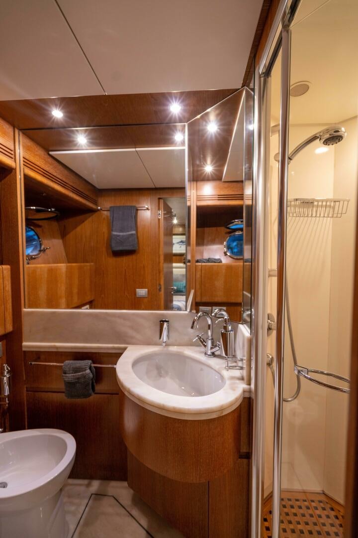 a bathroom with a sink and a shower aboard LOSAND Yacht for Sale