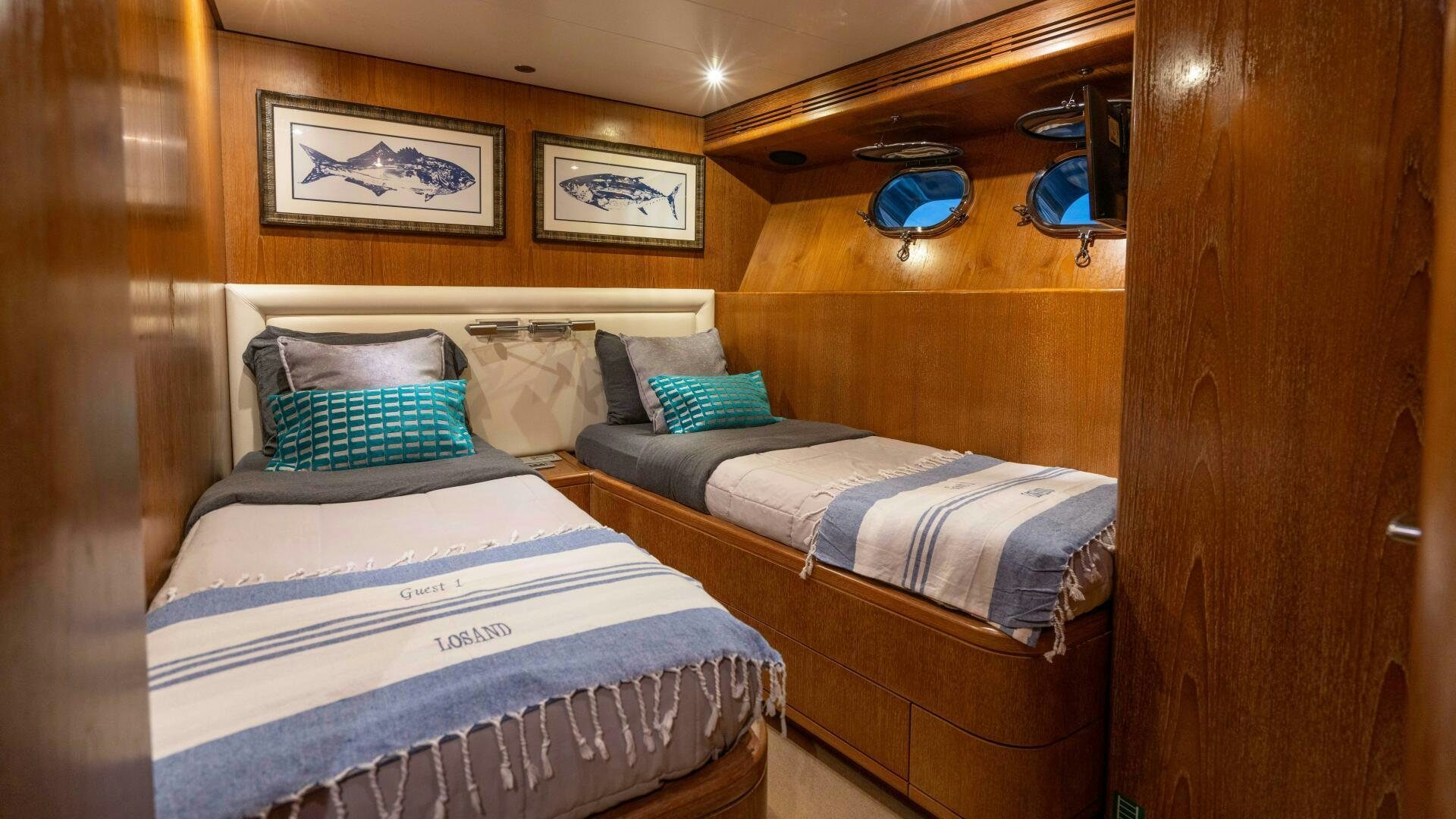 a couple of beds in a room aboard LOSAND Yacht for Sale