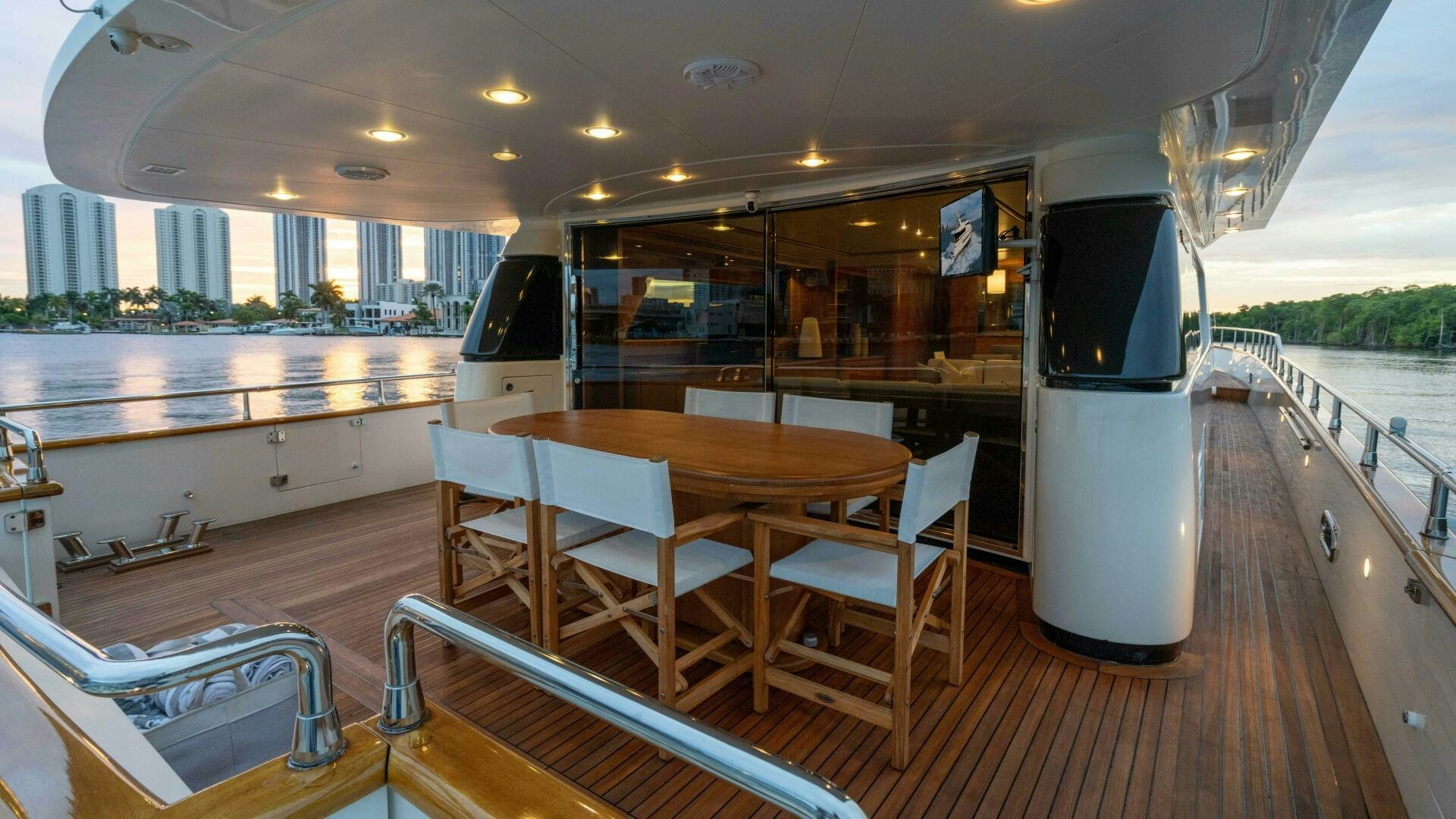 a boat with a table and chairs aboard LOSAND Yacht for Sale