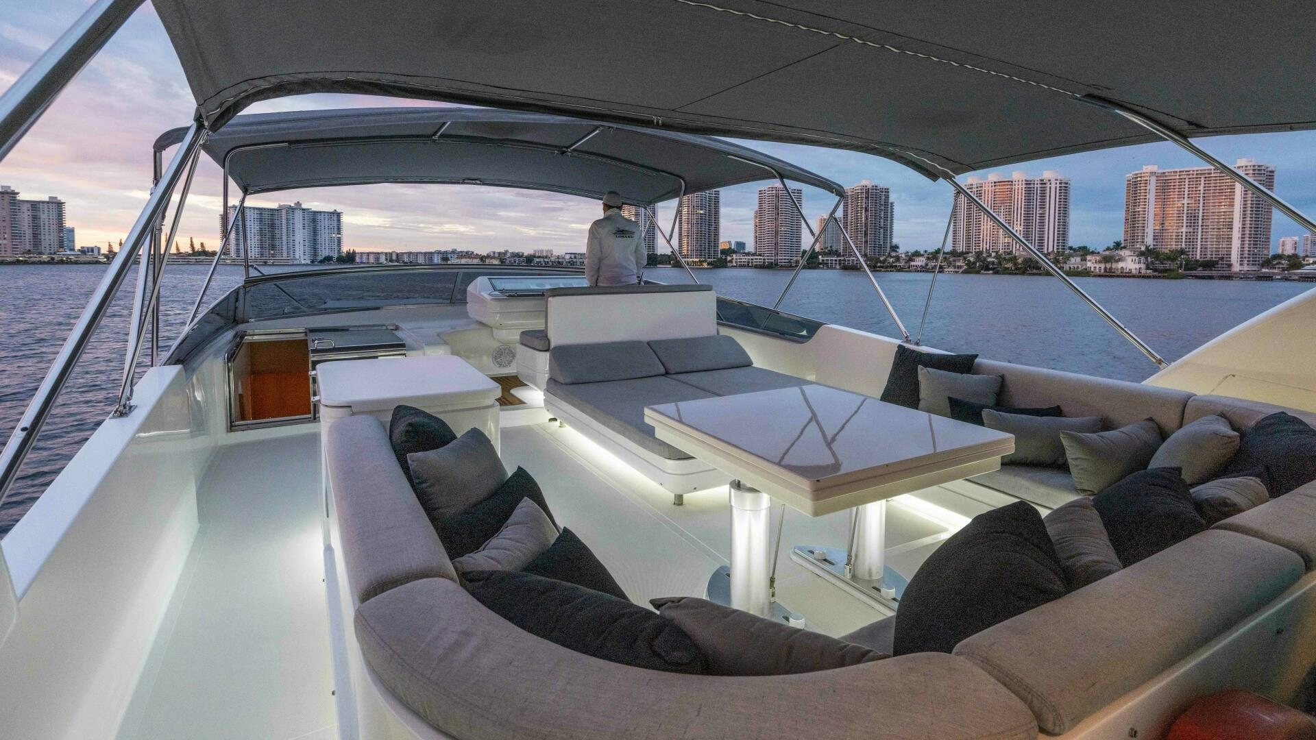 a boat with a large white table and chairs on it aboard LOSAND Yacht for Sale