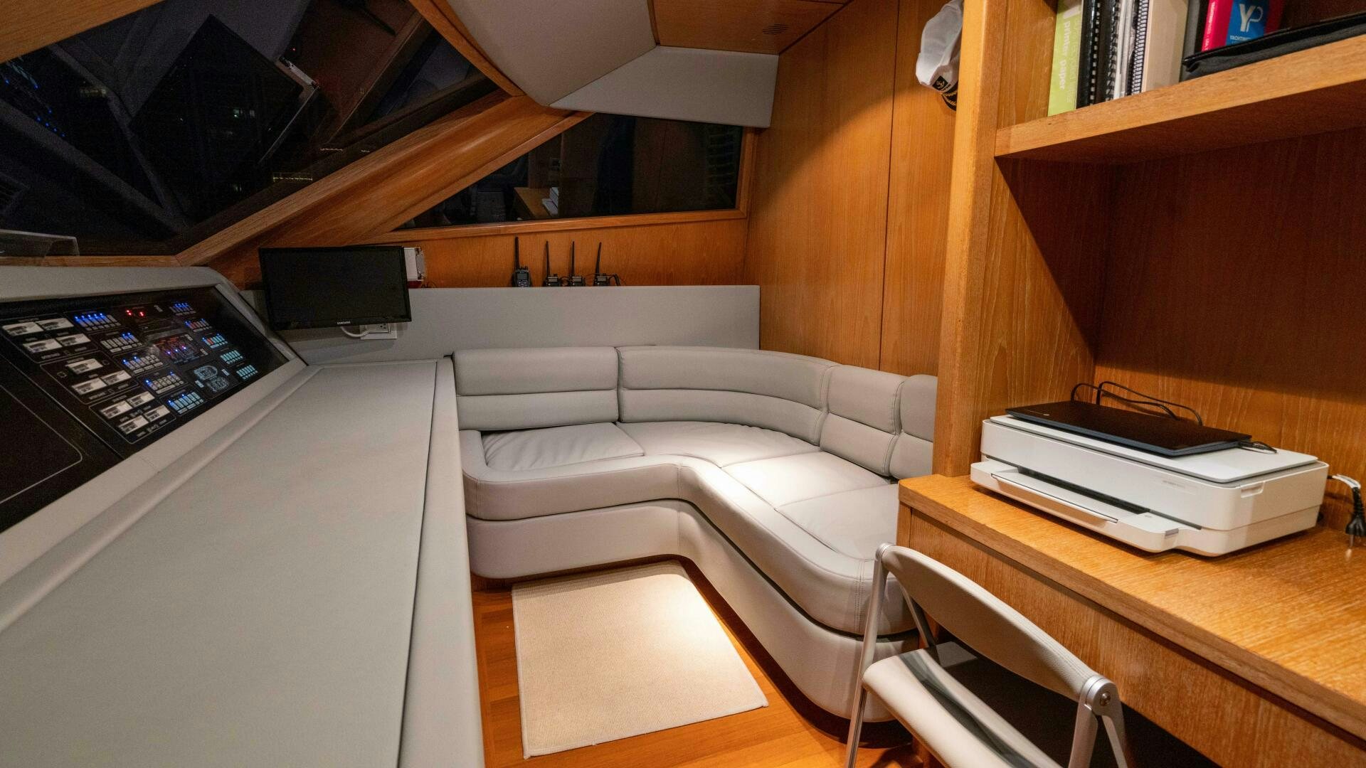 a room with a bed and a desk aboard LOSAND Yacht for Sale
