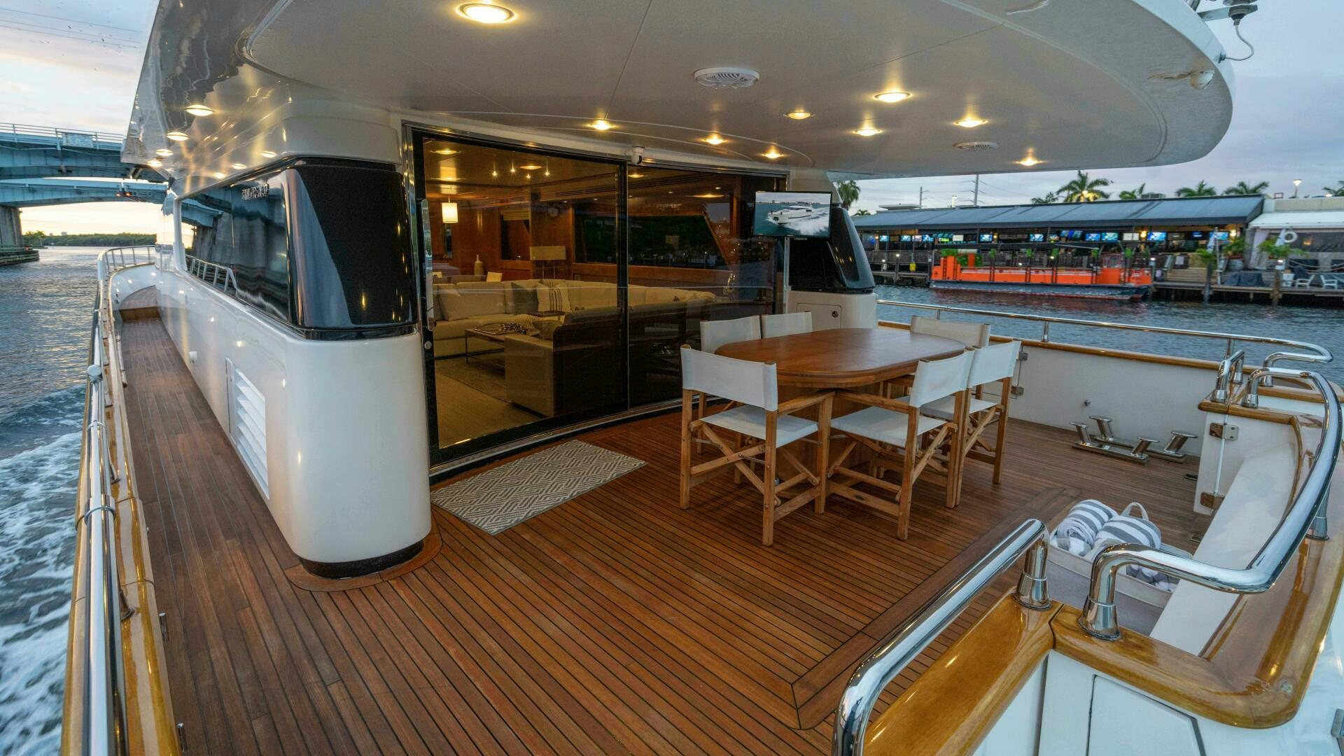 a boat with a table and chairs aboard LOSAND Yacht for Sale