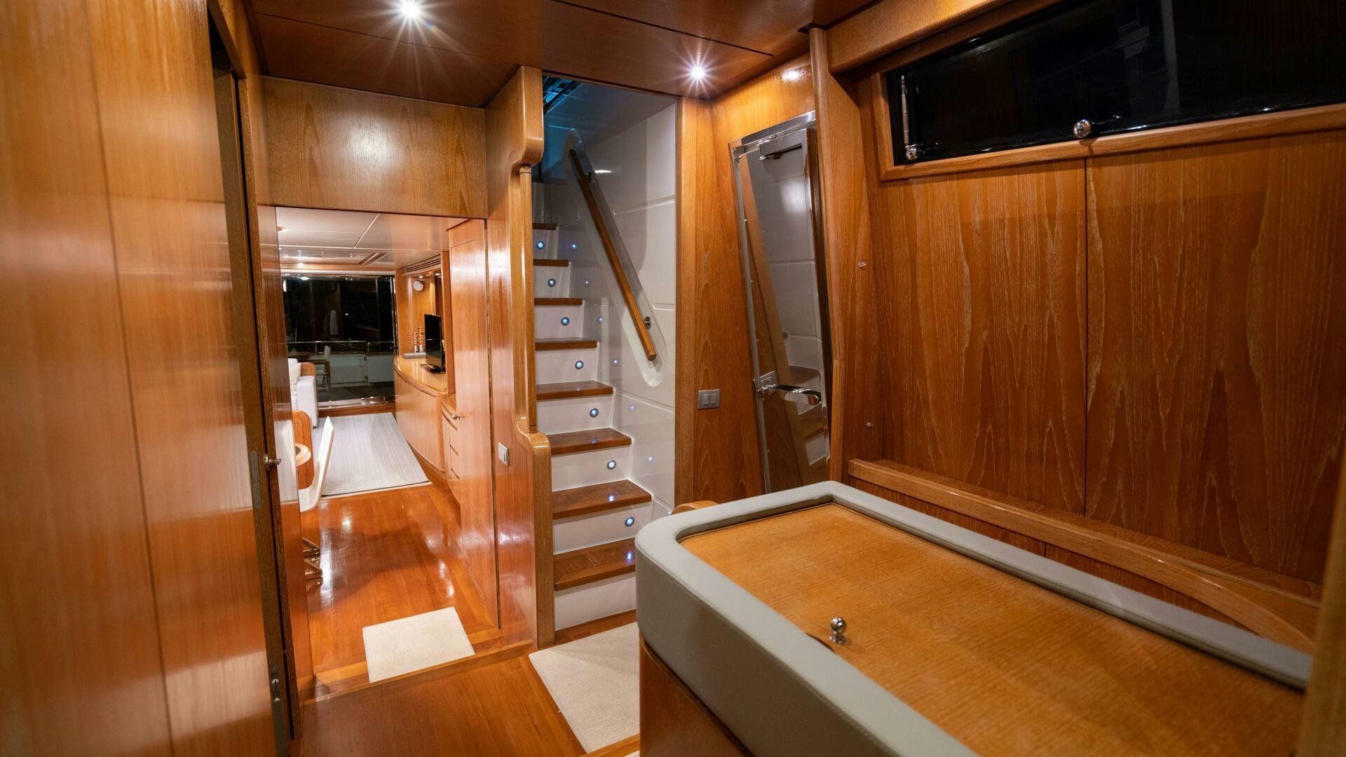 a room with wooden cabinets aboard LOSAND Yacht for Sale