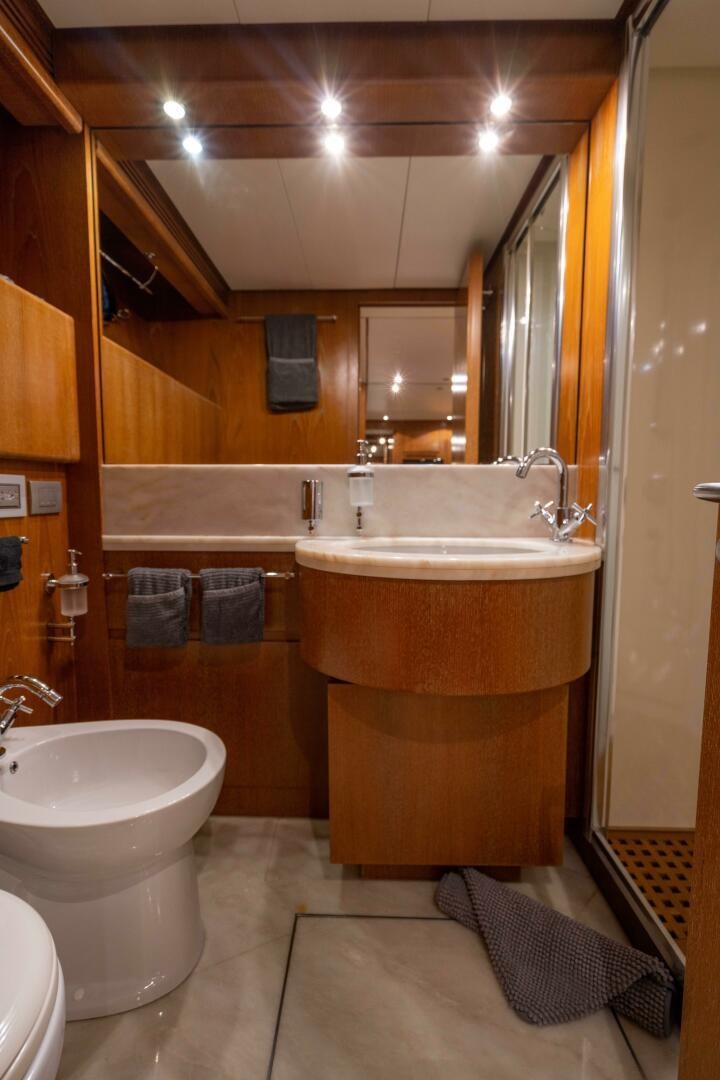 a bathroom with a sink and a bathtub aboard LOSAND Yacht for Sale