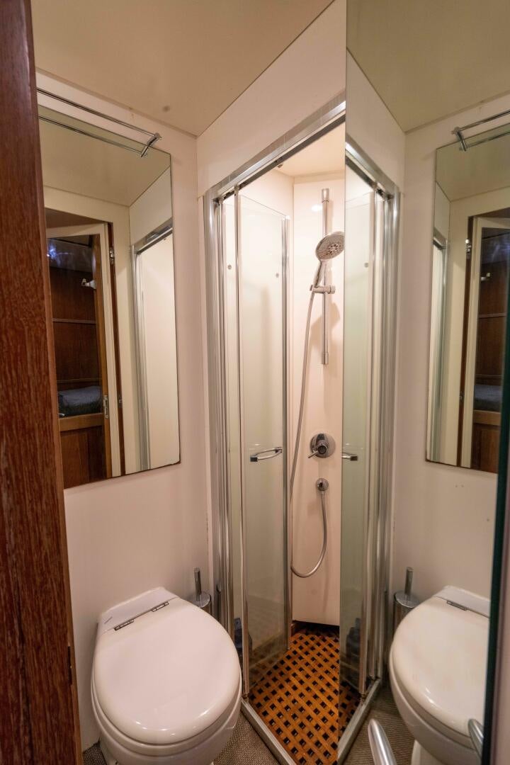 a bathroom with a glass shower aboard LOSAND Yacht for Sale