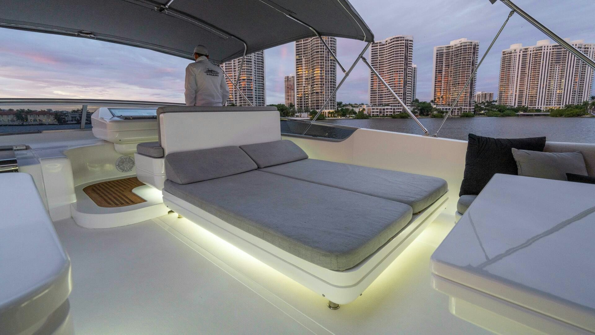 a large room with a table and chairs aboard LOSAND Yacht for Sale