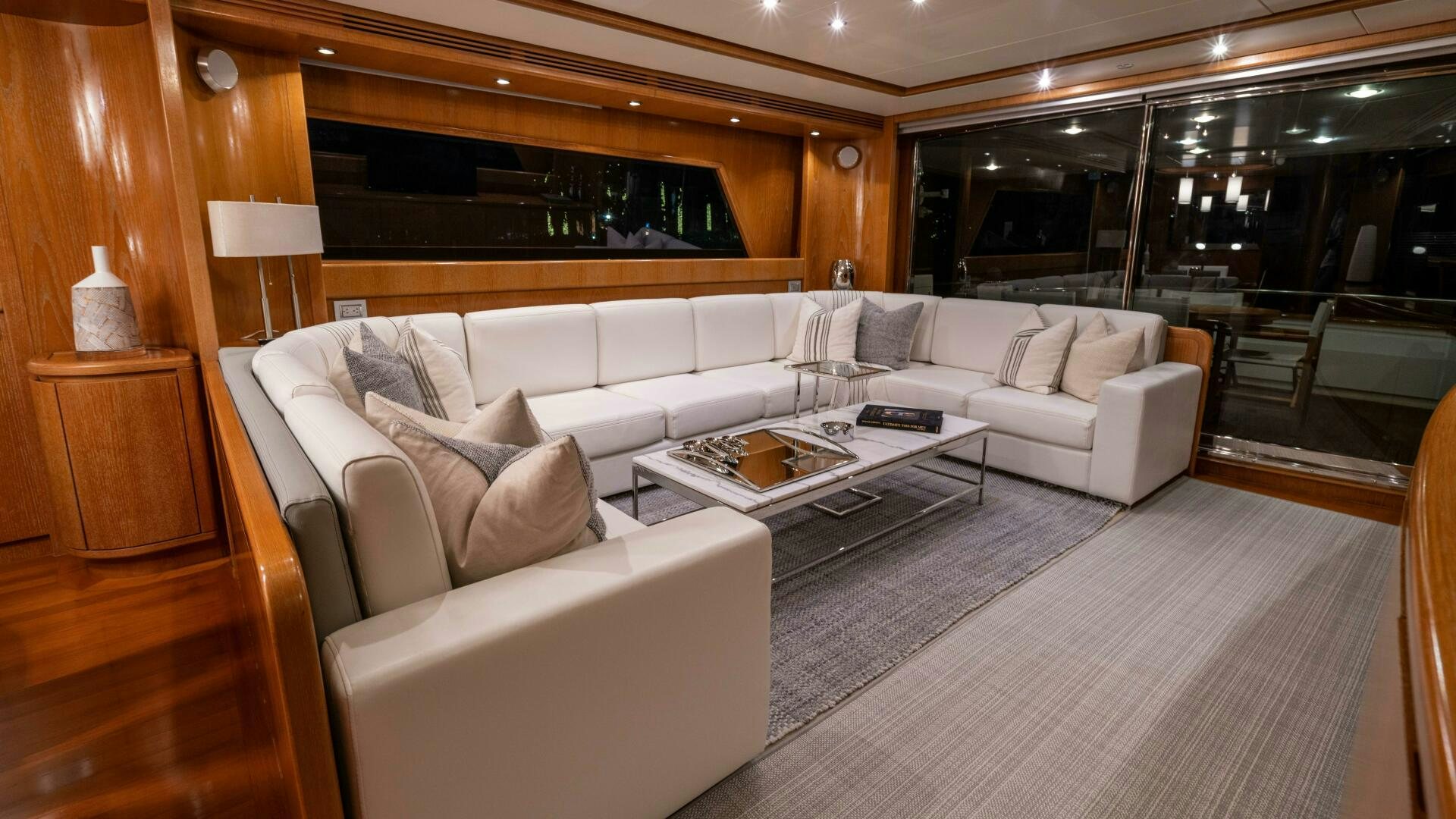 a living room with a large window aboard LOSAND Yacht for Sale