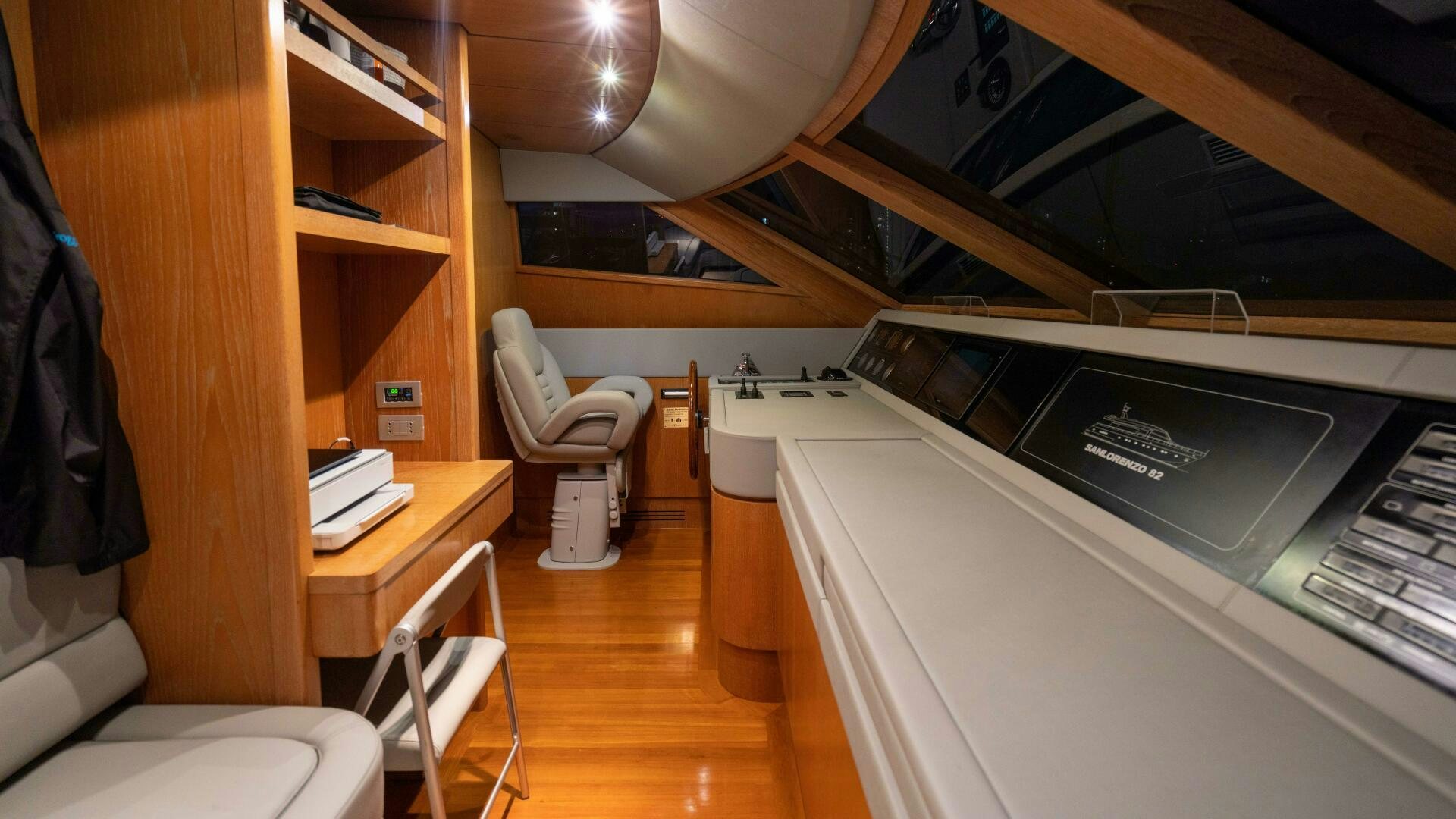 a room with a bed and desk aboard LOSAND Yacht for Sale
